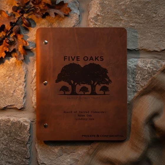 Five Oaks leather folio — an oak tree silhouette embossed in full-grain leather with three metal rivets